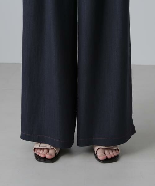 【新品】◎ADORE 濃紺デニム見えタックワイドパンツ 94丈 アドーア ADORE(アドーア)｜ハイブリッドデニムパンツ/ネイビー の通販