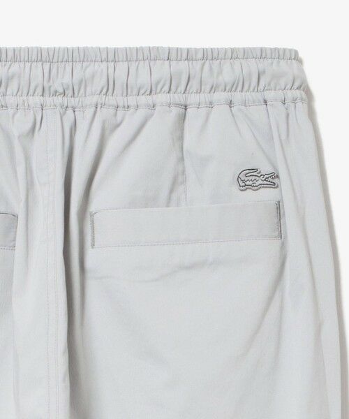 LACOSTE ホワイト ガウチョパンツ 34サイズ セール】 センタープレスワイドイージーパンツ ワイドパンツ