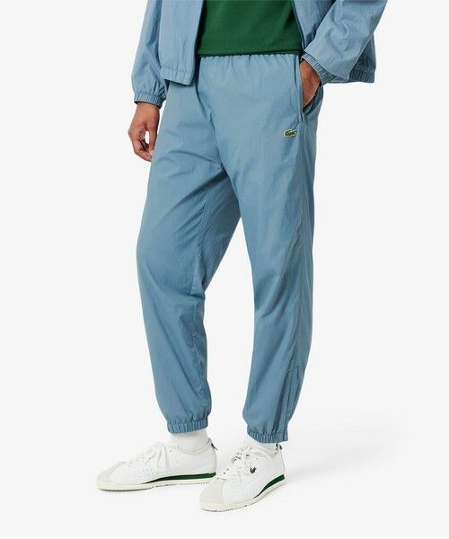 LACOSTE/ラコステ ワッシャー加工 ナイロン 軽量撥水トラックパンツ グレイッシュブルー 5(日本サイズXL) LACOSTE/ラコステ ワッシャー加工 ナイロン 軽量撥水トラックパンツ グレイッシュブルー 5(日本サイズXL)