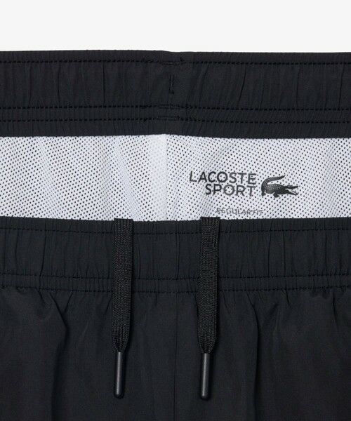 LACOSTE / ラコステ チノ・ワークパンツ | 配色パイピング撥水トラックパンツ | 詳細2