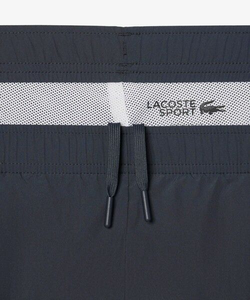 LACOSTE / ラコステ チノ・ワークパンツ | 配色パイピング撥水トラックパンツ | 詳細12