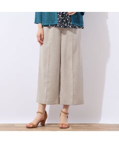 ■商品紹介■<br><b>【洗える】【セットアップ対応】</b><br><font color='#0063B1'>◆ベストとセットで楽しめる！ラクに穿けてきちんと見えるワイドクロップド◆</font><br><br>スラブ感のあるストレッチ素材のパンツです。<br>シワになりにくくご自宅で洗えるイージーケアが特徴。<br>裏地のない軽快な仕立てで春夏シーズンに活躍するボトムです。<br><br>足の形が出にくいワイドシルエット。<br>ウエストは総ゴム仕様でゆったり快適な穿き心地です。<br><br>足首が出る丈で軽快に穿けるのも嬉しい。<br><br>シリーズのベストとセットアップで着用していただけます。<br>ベスト…製品品番12003511<br><br>・手洗い可<br><br>【モデル身長166cm】<br><br><br>■コーディネート■<br>Tシャツやブラウスなど様々なトップスとコーディネートを楽しめます。<br>合わせるアイテムによってカジュアルにもエレガントにも着まわせるのがポイント。<br>シリーズのベストとのセットアップススタイルもおすすめです。<br><br>■商品特性■<br>素材の厚さ：やや薄い<br>素材の透け感：透けない<br>素材の光沢：光沢がない<br>素材の伸縮性：ある<br>裏地仕様：裏なし<br>ウエスト仕様：総ゴム仕様(ファスナー開きなし)<br>前ポケットあり<br><br><br>■コンセプト■<br>旬なデザイン、素材を使ったトレンドアイテムから上質で高級感溢れるエレガンスアイテムまでを揃えたタウンコーディネートブランド。<br><br>＊撮影環境により光の当たり具合で色味が違って見える場合があります。<br>＊商品画像はサンプルのため、色味やサイズ、プリント位置、仕様などに変更がある場合があります。<br>＊取扱い表示をご確認の上、着用をお願いします。<BR>