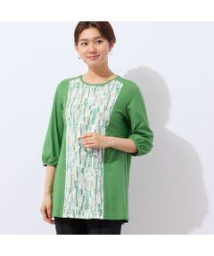 ■商品紹介■<br><b>【洗える】</b><br><font color='#0063B1'>◆コーディネートの主役になるカラーチュニック◆</font><br><br>日差しに映えるカラーが目を惹くチュニック。<br>表面の毛羽立ちを抑え、さらりとした着心地にこだわった綿天竺を使用しています。<br><br>前身中央にはカットジャカードを使用した異素材ミックスのデザインです。<br>程よい透け感のあるジャカードに幾何柄をプリント。脇を無地で切り替えることでスッキリとした印象で着ていただけます。<br><br>ジャカード部分の下側には裏地を重ねているので、一枚でも透けを気にせず着用していただけます。<br><br>パフスリーブで手元はフェミニンに。<br>後ろ襟ぐりはゴムで伸縮するので、被りでの着脱が簡単なのも魅力です。<br><br>・手洗い可<br><br>【モデル身長166cm】<br><br><br>■コーディネート■<br>スリムパンツとならスッキリとコーディネートしていただけます。<br>一枚で着映えする色とデザインで、春夏のお出かけに活躍間違いなしです。<br><br>■商品特性■<br>素材の厚さ：普通<br>素材の透け感：ジャカード部分はやや透ける<br>素材の光沢：光沢がない<br>素材の伸縮性：ある（ジャカード部分はなし）<br>裏地仕様：前身中央のみ裏つき<br>袖丈：7分袖<br>柄位置：商品によって異なる可能性あり<br><br><br>■コンセプト■<br>旬なデザイン、素材を使ったトレンドアイテムから上質で高級感溢れるエレガンスアイテムまでを揃えたタウンコーディネートブランド。<br><br>＊撮影環境により光の当たり具合で色味が違って見える場合があります。<br>＊商品画像はサンプルのため、色味やサイズ、プリント位置、仕様などに変更がある場合があります。<br>＊取扱い表示をご確認の上、着用をお願いします。<BR>