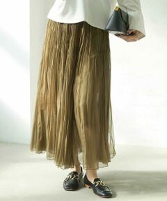 ◆レイヤードも楽しめるシアー素材が軽やかなプリーツスカート◆<br><br>＜デザイン・パターン＞<br>たっぷりと生地を使用した透け感のあるオーガンジー素材のプリーツスカートです。裾はふんわり広がりますが、腰回りのプリーツを細かくすることですっきり見え。ウエストゴムで履きやすさも魅力です。ペチコート付き。40サイズは限定店舗展開です。<br><br>＜素材＞<br>ソフトさとしなやかさを併せ持った風合いのポリエステルオーガンジーを細かいプリーツに。透け感があり軽やかな着心地が魅力。<br><br>＜着こなしポイント＞<br>ボリュームが出過ぎない細かなプリーツのスカートはオーバーなシルエットのトップスとあわせてリラックスした着こなしがおすすめ。透け感のあるスカートはあえてセットのペチコートを外して、パンツをあわせるレイヤードスタイルも楽しめます。<br><br>---------------------------------<br>・透け感：あり<br>・裏地：ペチコート付き<br>・伸縮性：なし<br>・光沢感：ややあり<br>・生地の厚さ：うすい<br><br>・ポケット：なし<br>・ウエスト：総ゴム<br>・ケア方法：洗える<br>-----------------------------<br>モデル（ショートボブ）身長：171cm/着用サイズ：M※照明や日光などの撮影環境により、色味が異なる場合がございます。予めご了承ください。商品の色味は、詳細画像をご参照ください。<br><br>MICHEL KLEIN（ミッシェルクラン）は、“シンプルとオリジナリティ”　“ベーシックとトレンド” 巧みなバランスで自分らしさを表現し、ファッションを楽しむ。そんな洗練された大人の女性が求める スタイリッシュで着心地の良い服を提案するパリ発信ブランドです。<br><br>《お気に入り登録》でお得な情報をお届け<br>再入荷通知や残りわずか、お得なプライスダウンの情報をお受け取りいただけます。