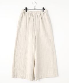 接結素材のワイドパンツです。<BR>ウエストはゴム仕様でリラックスしてお召しいただけます。<BR><BR>＊手洗い可<BR>＊両脇と、後ろヒップ左右にポケットつき<BR>＊風合いをだすために製品洗い、製品染めをしています。サイズにバラツキがありますので、あらかじめご了承ください。<BR><BR><BR>【生地】<BR>表がコットン/リネン、裏がコットンで二重織りしたギリシャ製の接結生地です。<BR>裏面にコットンサイドがくることで肌ざわりが良く、肌寒い時期には温かみを、暑い時期には清涼感を感じていただける素材です。