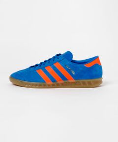 <b>adidas/アディダス</b><br><br>アディダス(adidas)はドイツのスポーツブランド。 スポーツ用品からシューズ、スポーツウェア、ファッションアイテムなど幅広いジャンルで製造から販売まで手掛けている人気ブランドです。<br><br><br><br>【2024 Autumn/Winter】【24AW】<br><br>※靴箱破損につきましては、商品に不良が無い場合に限り出荷させていただいております。予めご了承ください。<br>※この商品(BLUE)は、実際は蛍光色の強い色味です。予めご了承ください。<br>※その他お取り扱いに関しましては、商品に付属のアテンションタグをご覧ください。<br><br>重量(片足) : 約330g<br><br>※商品画像は、光の当たり具合やパソコンなどの閲覧環境により、実際の色味と異なって見える場合がございます。予めご了承ください。<br>※商品の色味の目安は、商品単体の画像をご参照ください。<br><br>-----------------------------<br><b>《スタッフレビュー》</b><br>試着サイズ : 26 / 26.5<br>26は甲幅・足長ともにぴったりでした。26.5は甲幅はぴったりで足長は少しゆとりがありました。個人的には26の方がフィット感があり履きやすかったです。クッション性があるので長時間履いても疲れにくそうです。<br>[スタッフデータ]<br>普段の着用サイズ : 26cm<br>足長 : 25cm<br>足囲 : 23.5cm<br>足幅 : 普通<br>※履き心地には個人差がございますので、あくまでも目安としてご覧ください。<br>-----------------------------<br><br><br><b>▼お気に入り登録のおすすめ▼</b><br>お気に入り登録商品は、マイページにて現在の価格情報や在庫状況の確認が可能です。<br>お買い物リストの管理に是非ご利用ください。